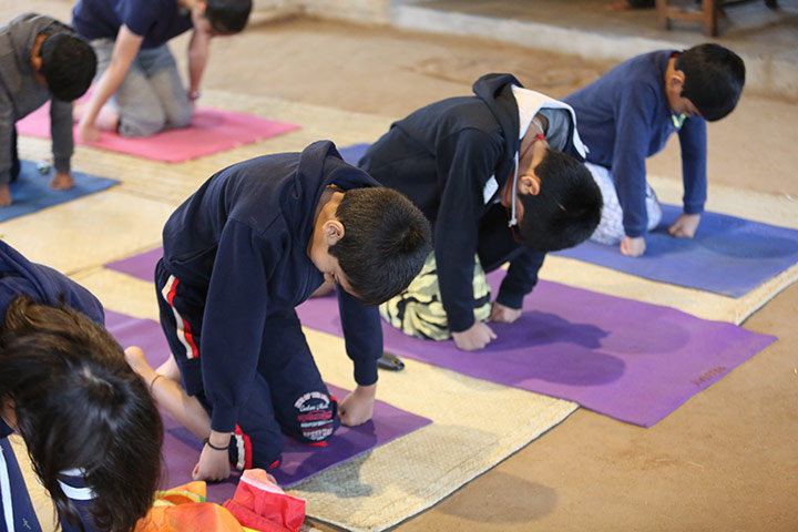 children doing isha yoga